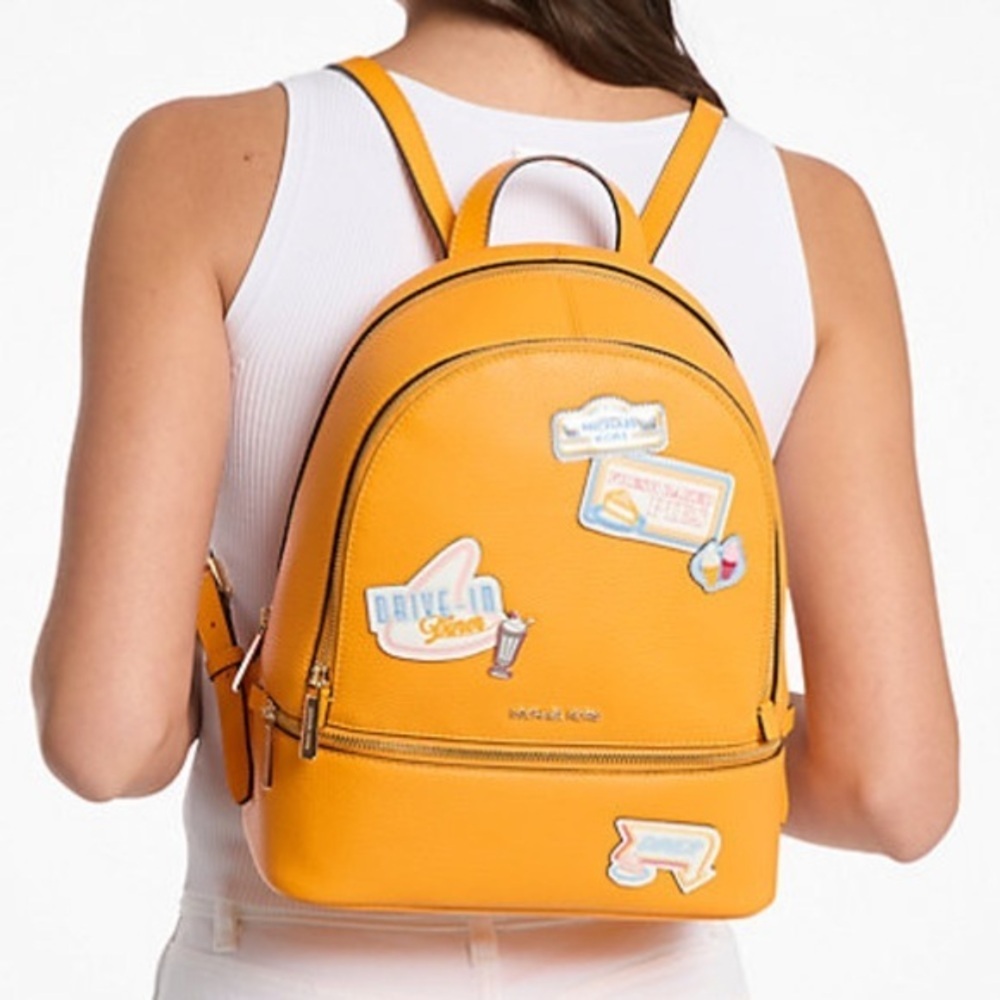 Michael Kors Vibrant Orange Backpack with Fun Patches
